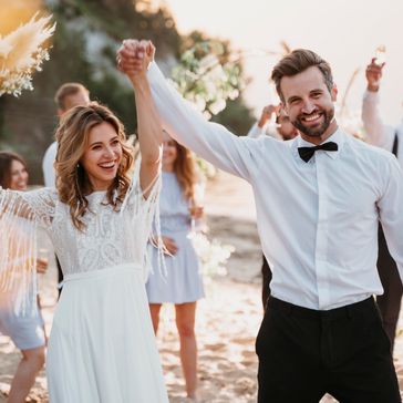 bride-groom-having-their-wedding-with-guests-beach